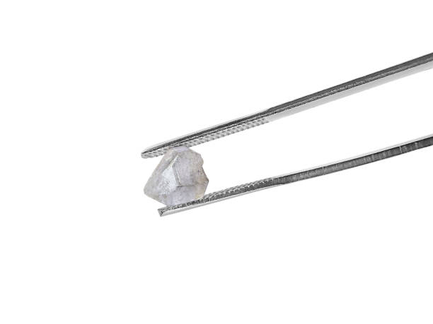 istock natural diamond on white background held in diamond tweezers 1413067955
