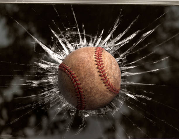 baseball attraverso la finestra rotta. per il design - baseballs baseball breaking broken foto e immagini stock