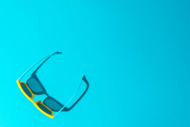 istock Plastic sunglasses on turquoise blue background with copy space 1413068170