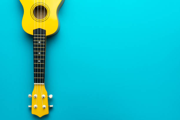 istock Flat lay photo of yellow ukulele with copy space 1413068227