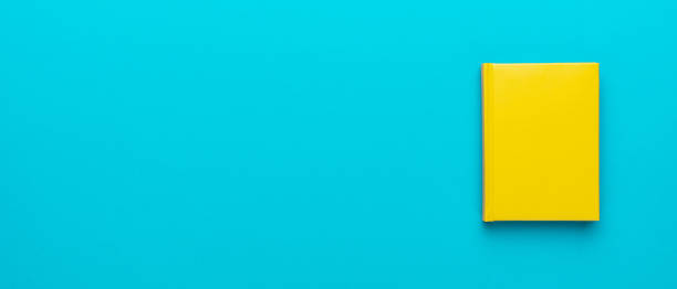 istock Top view of notebook over turquoise blue background and copy space 1413068231