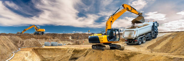 excavator is digging on construction site stock photo