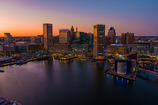 An aerial view of Baltimore's Inner Harbor at dusk