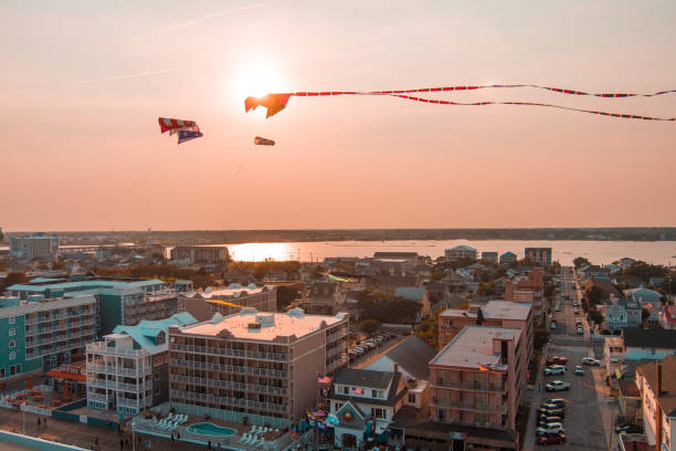 Sunset Kite A kite flies above Ocean City Maryland's beach at sunset kite sailing stock pictures, royalty-free photos & images