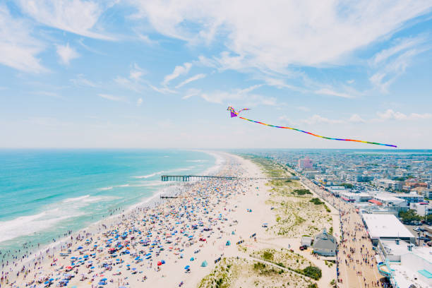 Beach Kite A kite flies over Ocean City New Jersey's beach kite sailing stock pictures, royalty-free photos & images