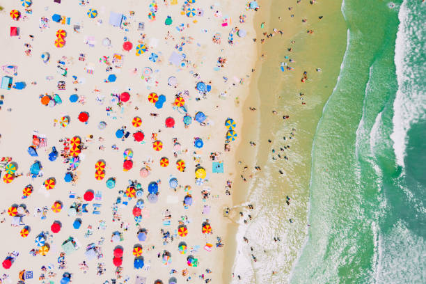 Beach Looking Down 3 A top down aerial view of Ocean City New Jersey's beach during the summer ocean city beach in summer stock pictures, royalty-free photos & images