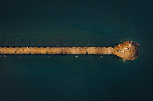 An aerial top down view of a pier in North Carolina at dawn