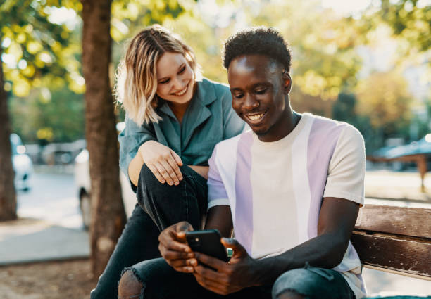 istock Multiracial couple having video call on smart phone 1413078072