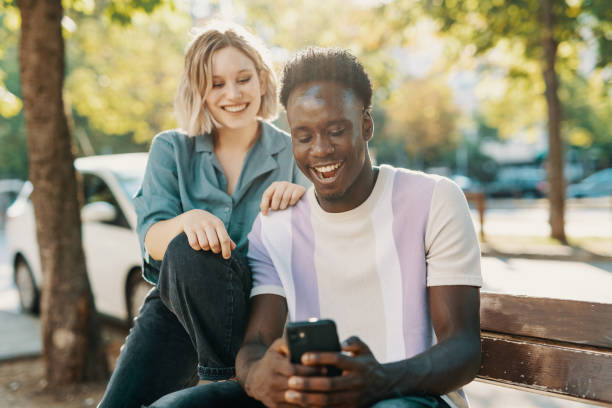 istock Multiracial couple having video call on smart phone 1413078150