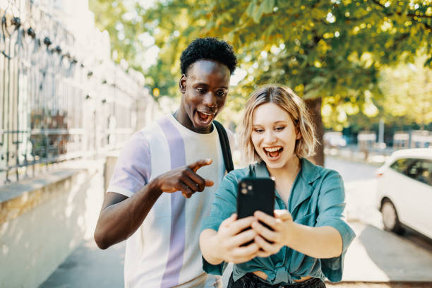 istock Multiracial couple having video call on smart phone 1413078839