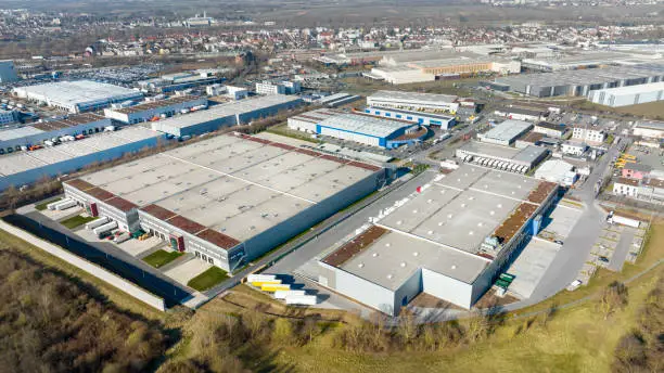 Photo of Aerial view of industrial district, large factory and distribution buildings