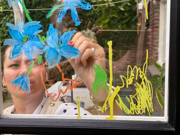 Woman makes a window paint