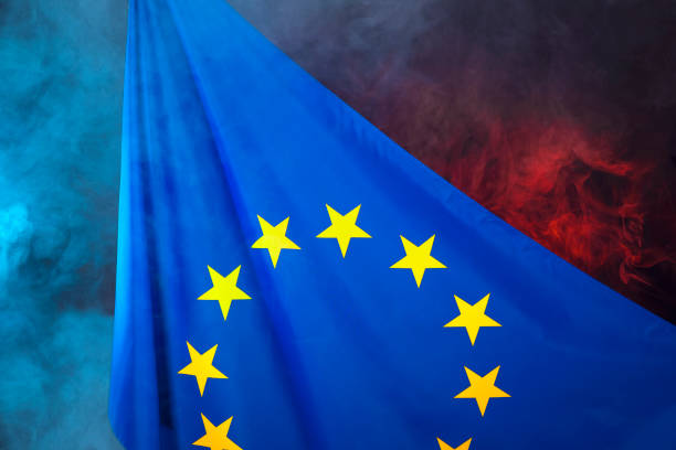 istock European union flag on red blue smoke background, symbol 1413083078