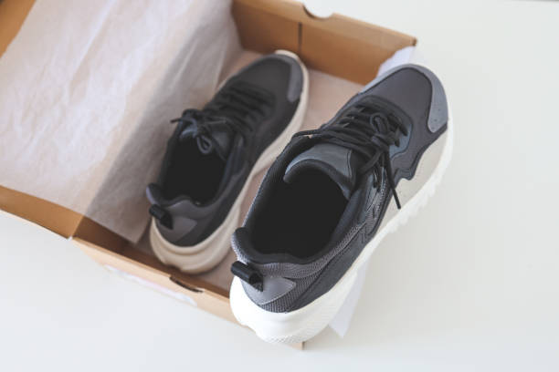 istock Men's sneakers in an open box, top view 1413086648