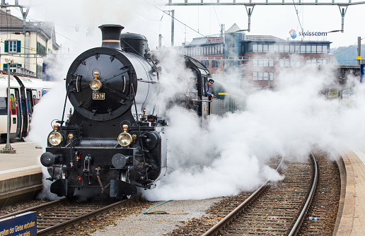 Olten, Switzerland - April 23, 2022 : special train hauled by steam locomotive C 5/6 from Swiss Federal Railway (historic)
