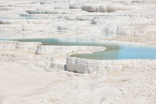 Pamukkale white mineral limestone natural pool. Geology landmark in Turkey