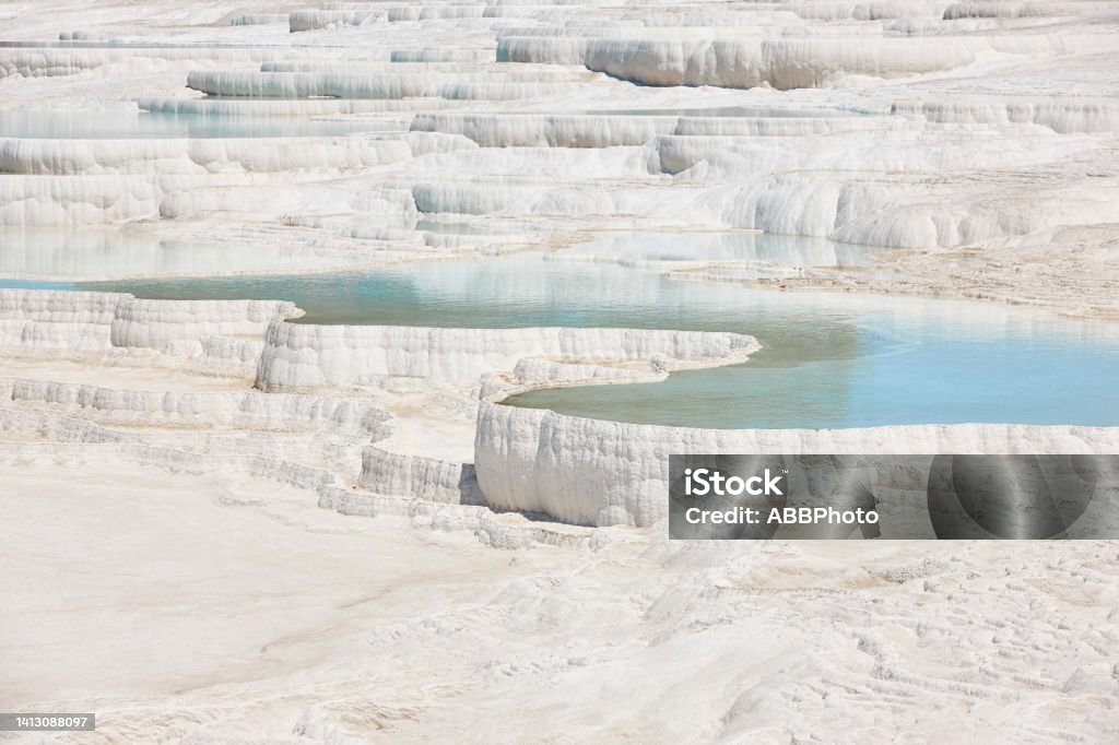 Pamukkale white mineral limestone natural pool. Geology landmark. Turkey Pamukkale white mineral limestone natural pool. Geology landmark in Turkey Hierapolis Stock Photo
