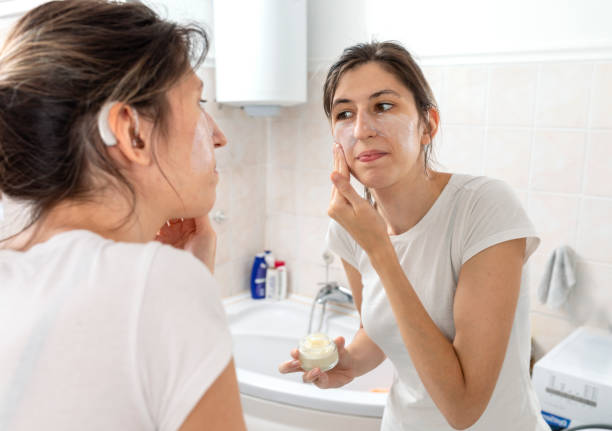 istock A young woman with cochlear implant  getting ready in the bathroom 1413088124