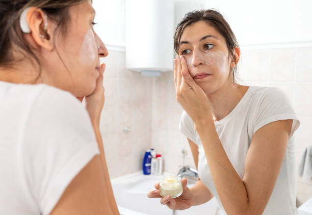 istock A young woman with cochlear implant  getting ready in the bathroom 1413088127