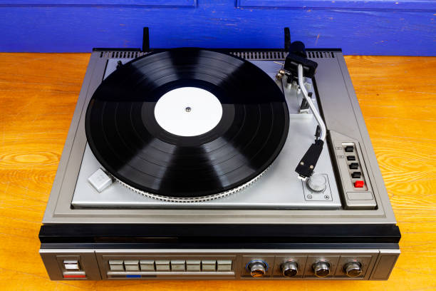 istock Vintage turntable vinyl record player with black vinyl 1413088338