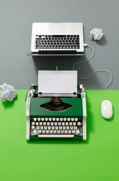 istock Digital und analog – Laptop and 70s Typewriter 1413088958