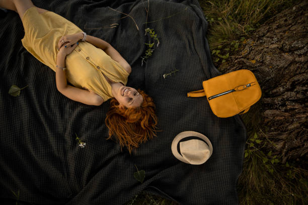 istock Woman lying in nature 1413092947