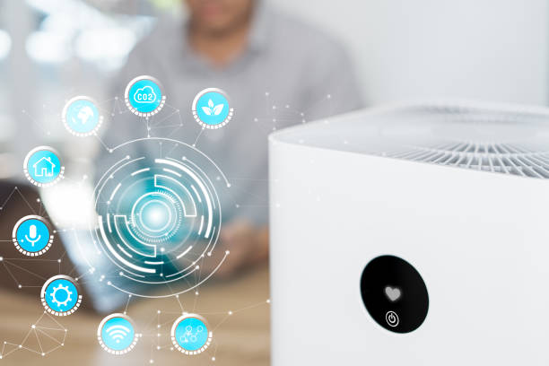 istock Home smart and technology on virtual screen concept,Close up air purifier and a man use smartphone control online on application adjust and setting for smart home through the internet 1413093589