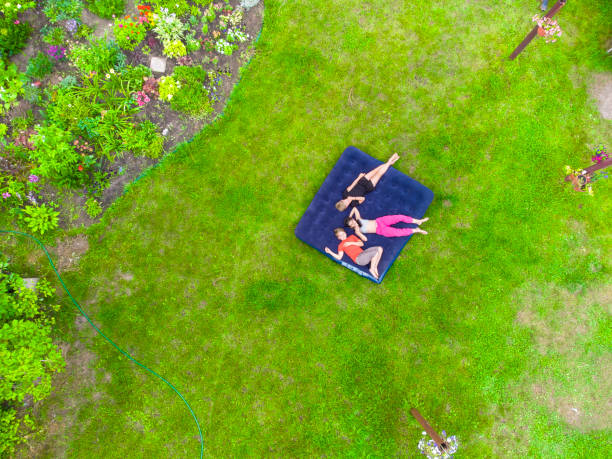 istock Happy kids lying on the grass 1413095179
