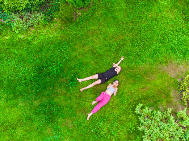 istock Happy kids lying on the grass 1413095198