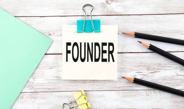 istock Stickers with pencils and notebook with text FOUNDER on wooden background 1413096105