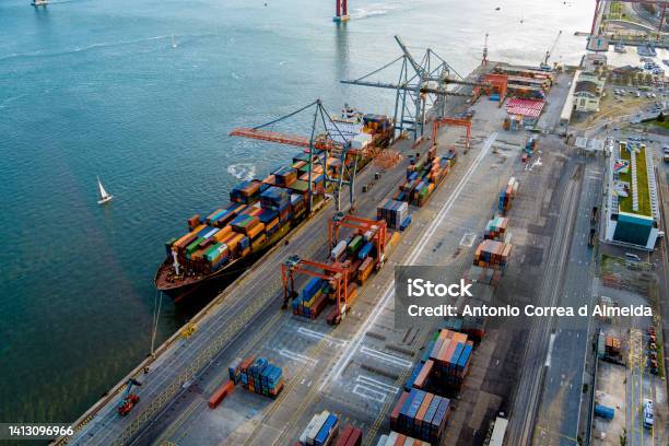 A Container Terminal In Lisbon Nearby The River Stock Photo - Download Image Now - Commercial Dock, Harbor, Ship