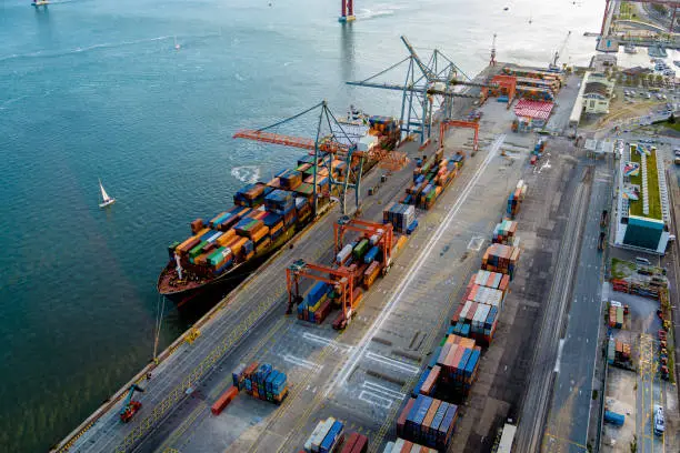 Photo of A container terminal in Lisbon nearby the river.