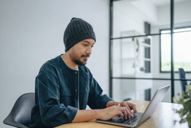 istock Mature man student having online session with students during lockdown 1413100180