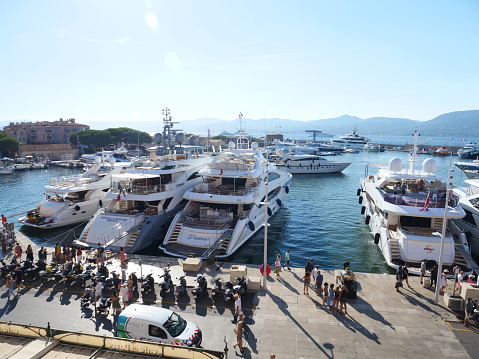 Saint-Tropez, France - August the 2nd 2022: a view of the beautiful yachts in the marina of Saint-Tropez.
