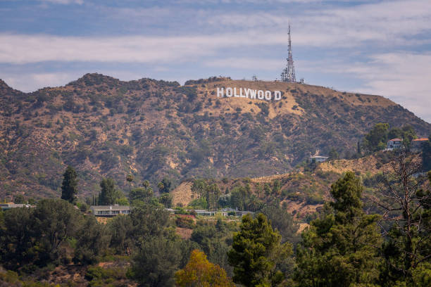 Los Angeles, CA, USA  August 4, 2022: A view of the Hollywood sign from Mulholland dam and Lake Hollywood in Los Angeles, CA.