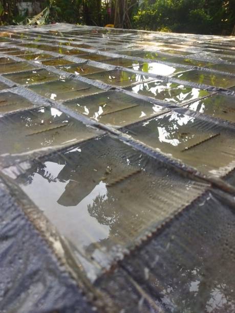 istock Close up rainwater collected on the plastic covering the concrete iron frame 1413103274