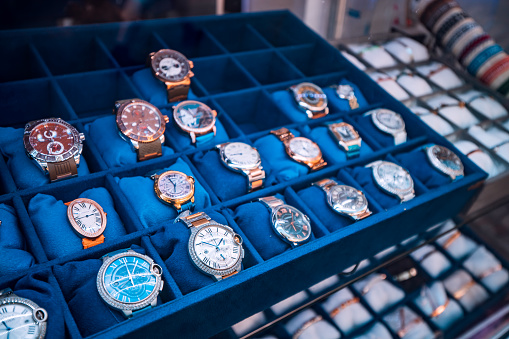 21 June 2022, Antalya, Turkey: Many vintage retro and modern Cartier luxury wristwaches and clocks for sale at store window