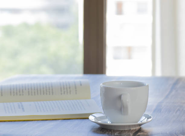 istock book on the table with cup of coffee 1413108333