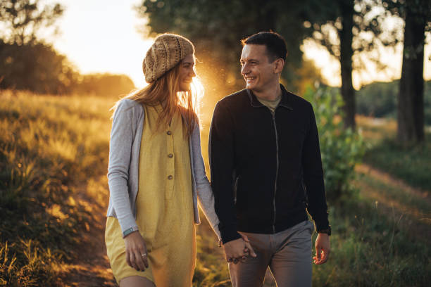 istock Couple taking a walk in sunset 1413112446