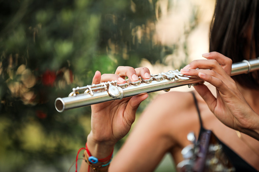 Young Woman Playing the Flute , Musician , Entertainment Culture