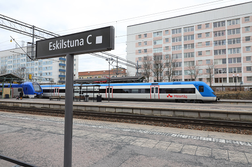 Eskilstuna, Sweden - April 24, 2022: View of the Eskilstina central railroad station with trains calling.