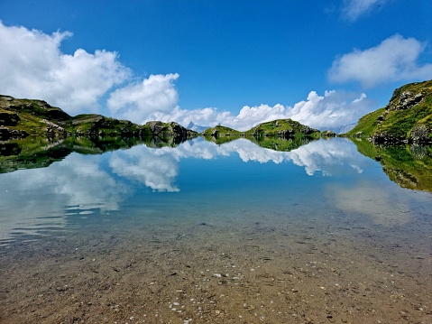 Idyllic Mountain lake named Milchspühlersee. The Lake is located in The Alps of the canton Glarus at an Altitude of 2196m - capturred during summer season,