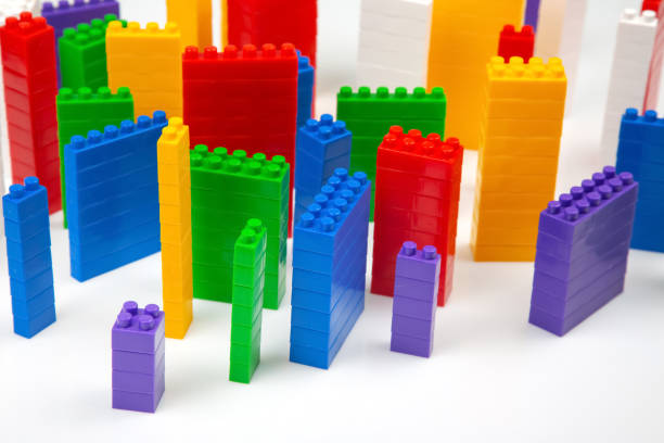 istock colored blocks of a plastic constructor on a white background in the form of multi-storey buildings. concept of modern buildings and houses 1413118524