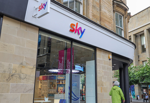 Glasgow, Scotland- July 16,2022: The branch shop of sky in Glasgow, Scotland. Sky UK Limited is a British broadcaster and telecommunications company that provides television and broadband Internet services, fixed line and mobile telephone services.