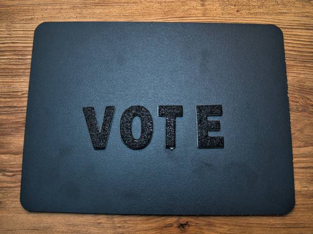 istock Vote - Black Lettering on Black Background 1413119558