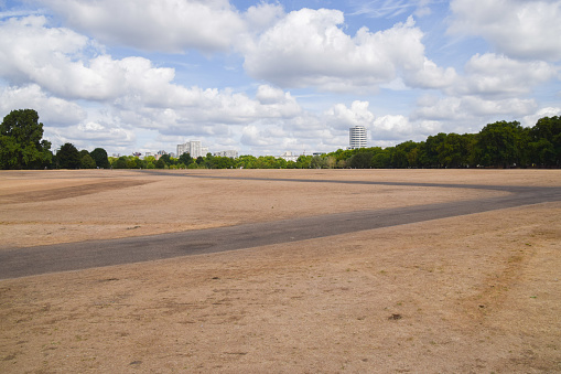Parched landscape in Hyde Park in London, as a result of persistent heatwaves and dry weather caused by climate change.