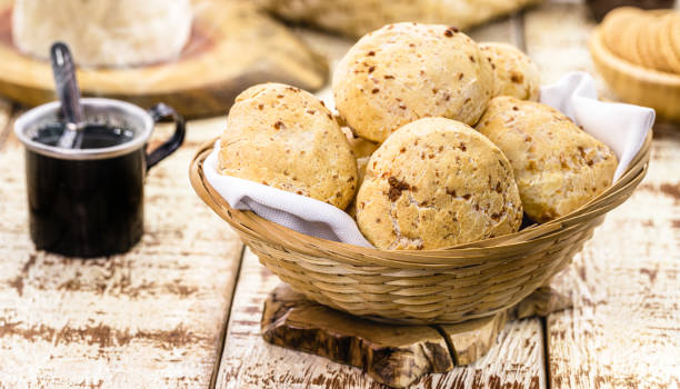 bowl full of traditional brazilian cheese bread or cheese biscuit, served crispy and hot, with coffee - lanche da tarde imagens e fotografias de stock