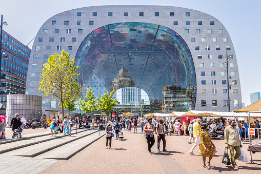 Rotterdam, Netherlands, June 1, 2021; Modern residential and retail building with indoor market hall in the center of Rotterdam.