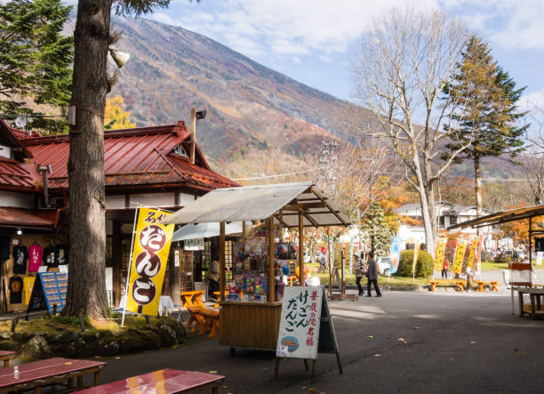 Souvenir stalls and food vendors at the entrance to the famous Kegon falls in Nikko national park stock photo