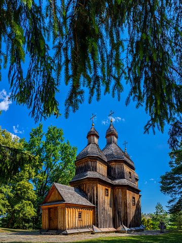 https://media.istockphoto.com/id/1413125357/photo/an-old-wooden-church-in-ukraine-rural-landscape-with-a-church-wooden-cossack-ukrainian-church.jpg?b=1&s=170667a&w=0&k=20&c=FCo9T6yvrT7u2AcJaNvC5UoyolmeIDs6fFS7k4gTuCM=
